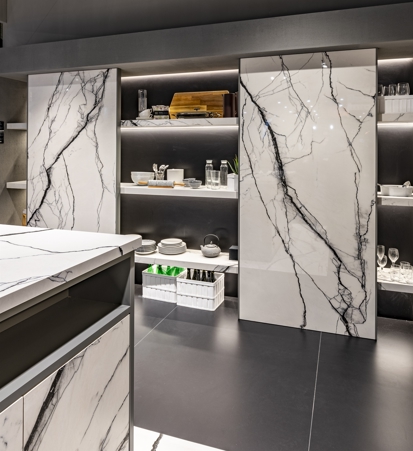 Cabinet with full height sliding doors made with Florim Stone Marble Breach matte porcelain stoneware slabs. The game of vein was created by combining two specular slabs and laying them in with book match.