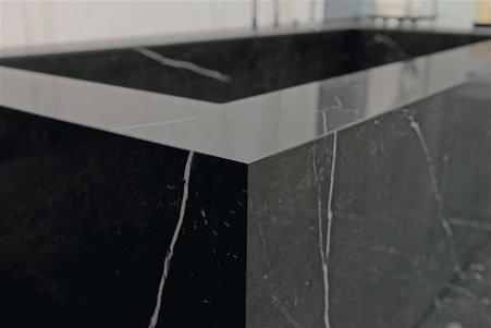 Modern rectangular bathtub entirely covered in customized glossy Marble Marquinia ceramic