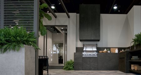 Custom-made kitchen that recalls the industrial style covered in Metal Burnished stoneware with matte finish